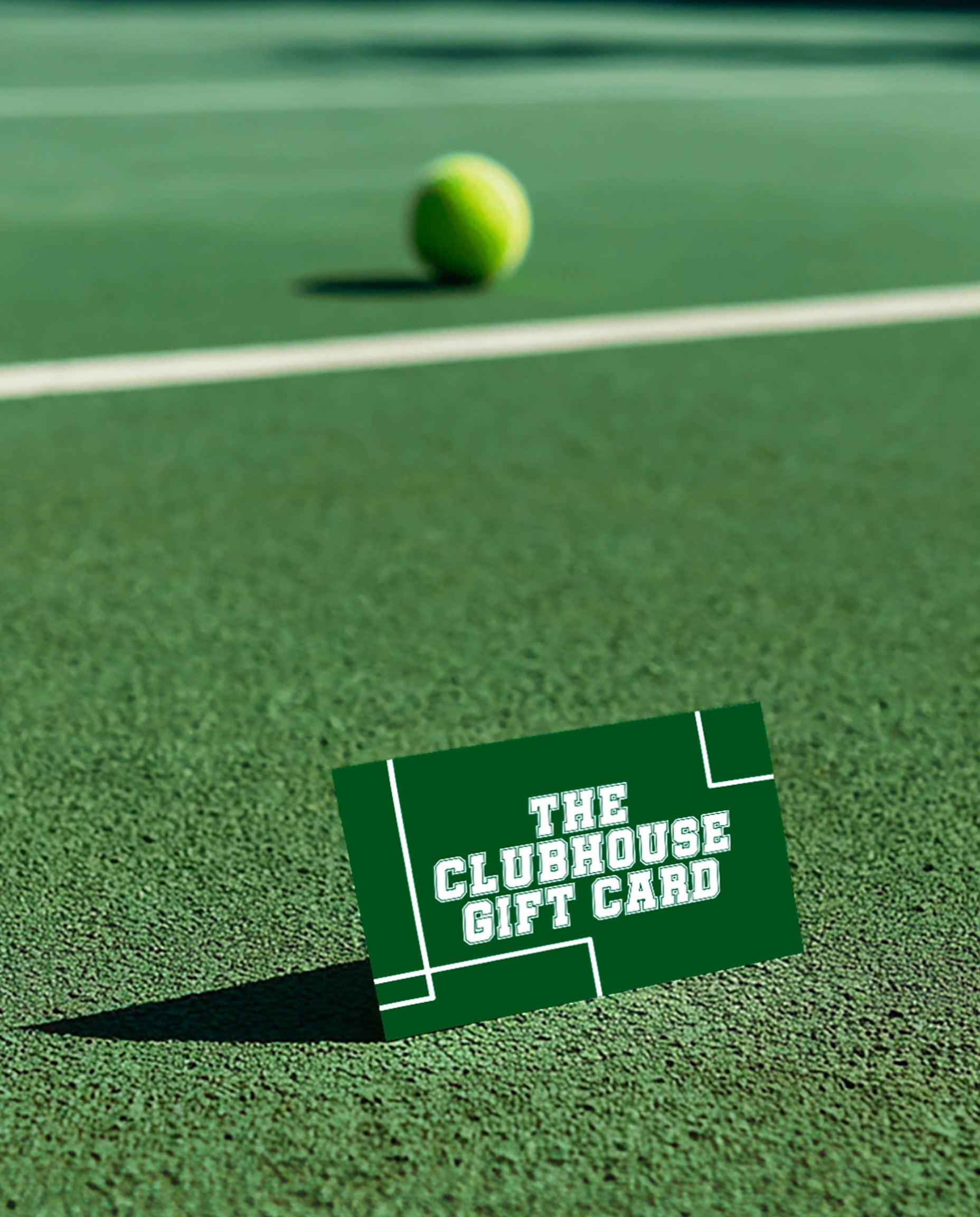 the smash society gift card on a padel court with a padel ball in the background