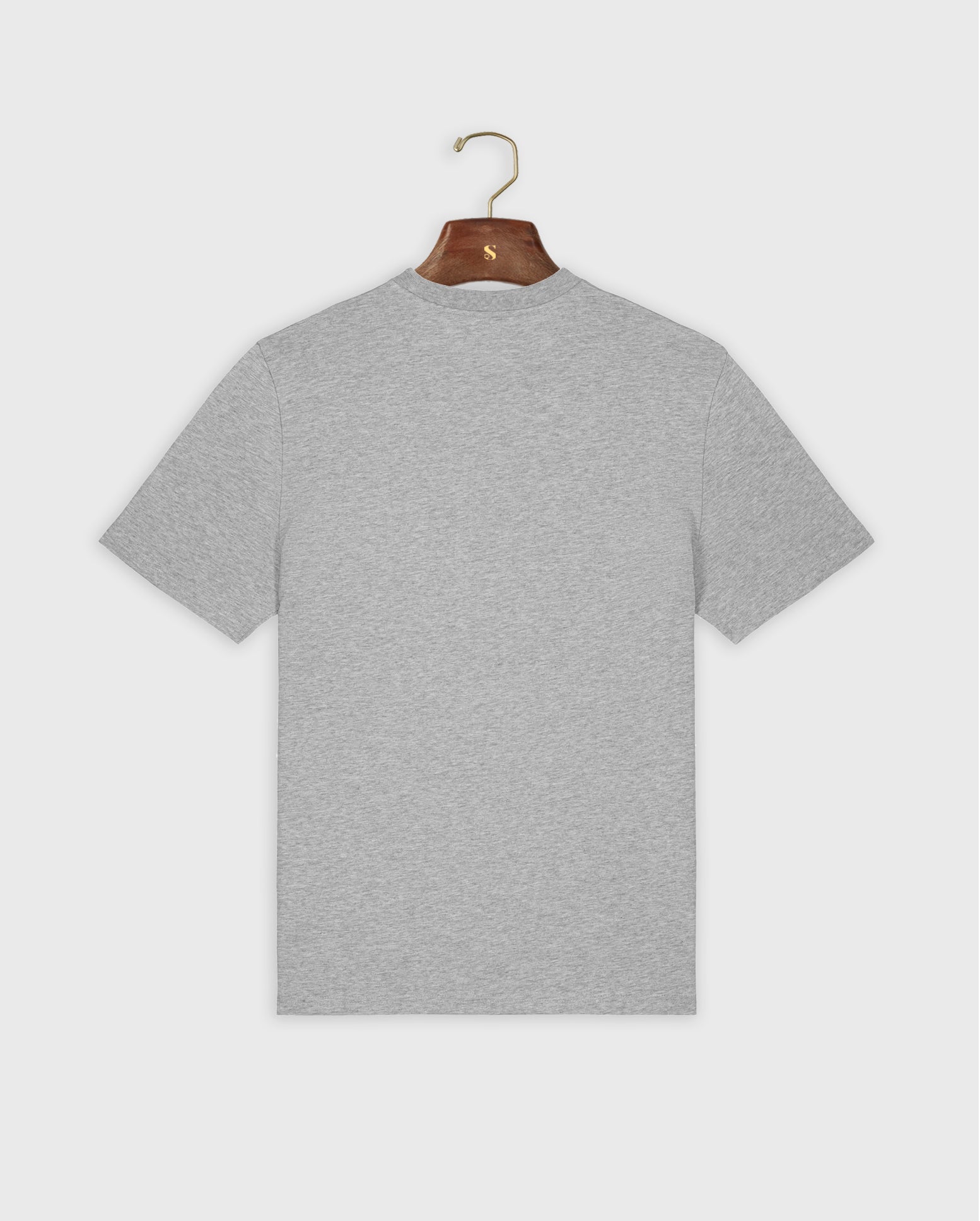 Gray padel t-shirt on a hanger against a white background