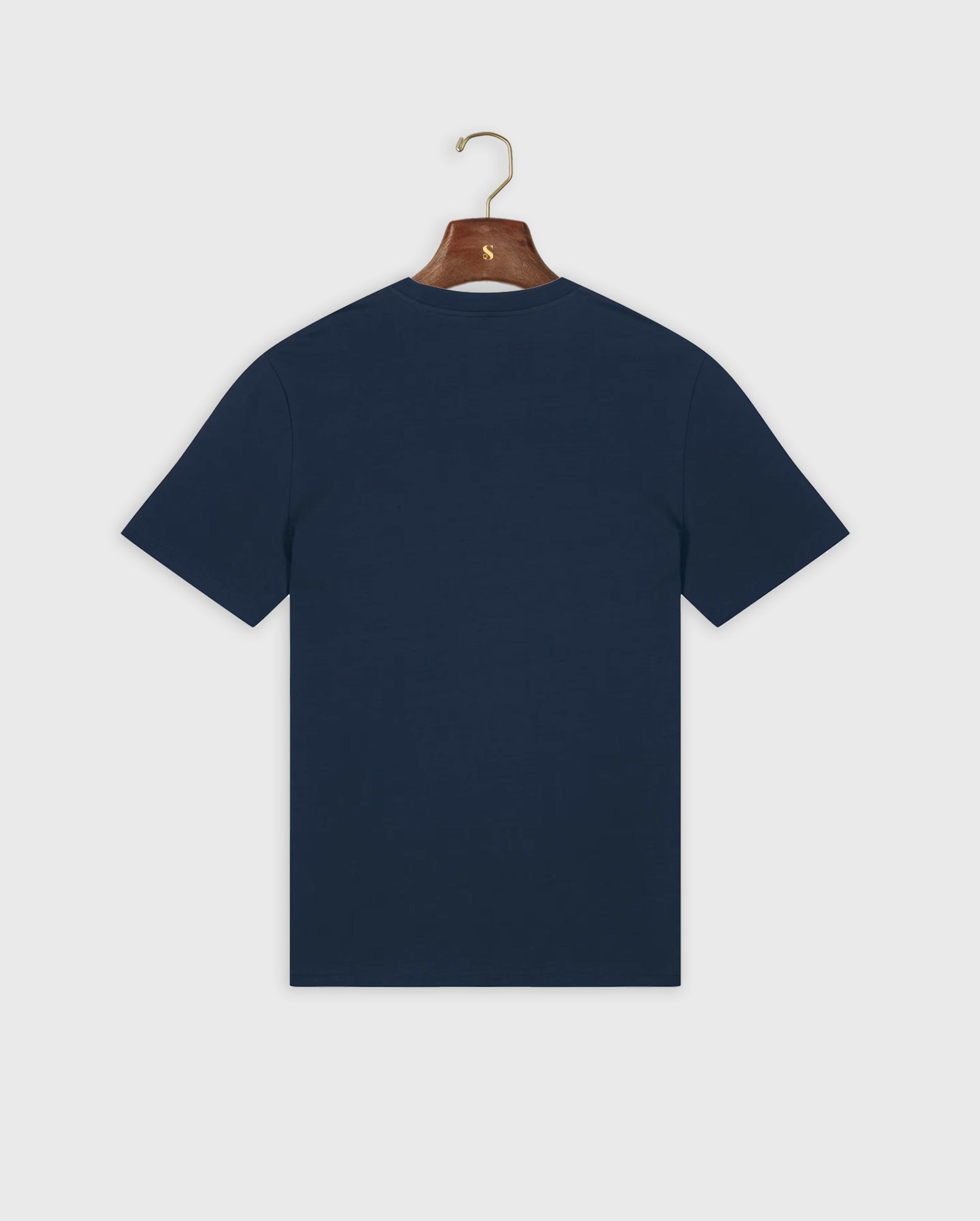 Navy blue padel t-shirt on a hanger against a white background