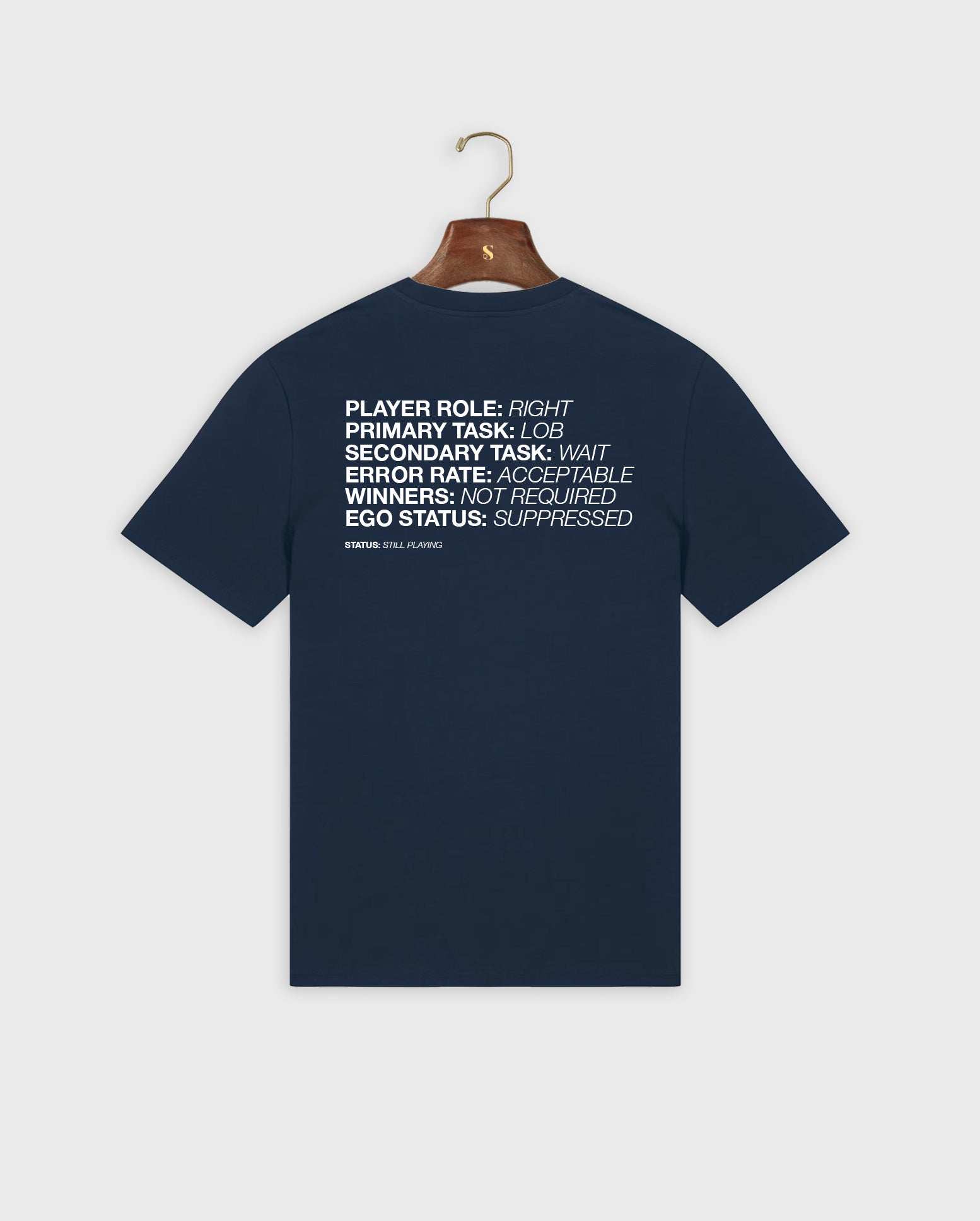 Navy blue padel t-shirt with white text on a hanger against a light gray background