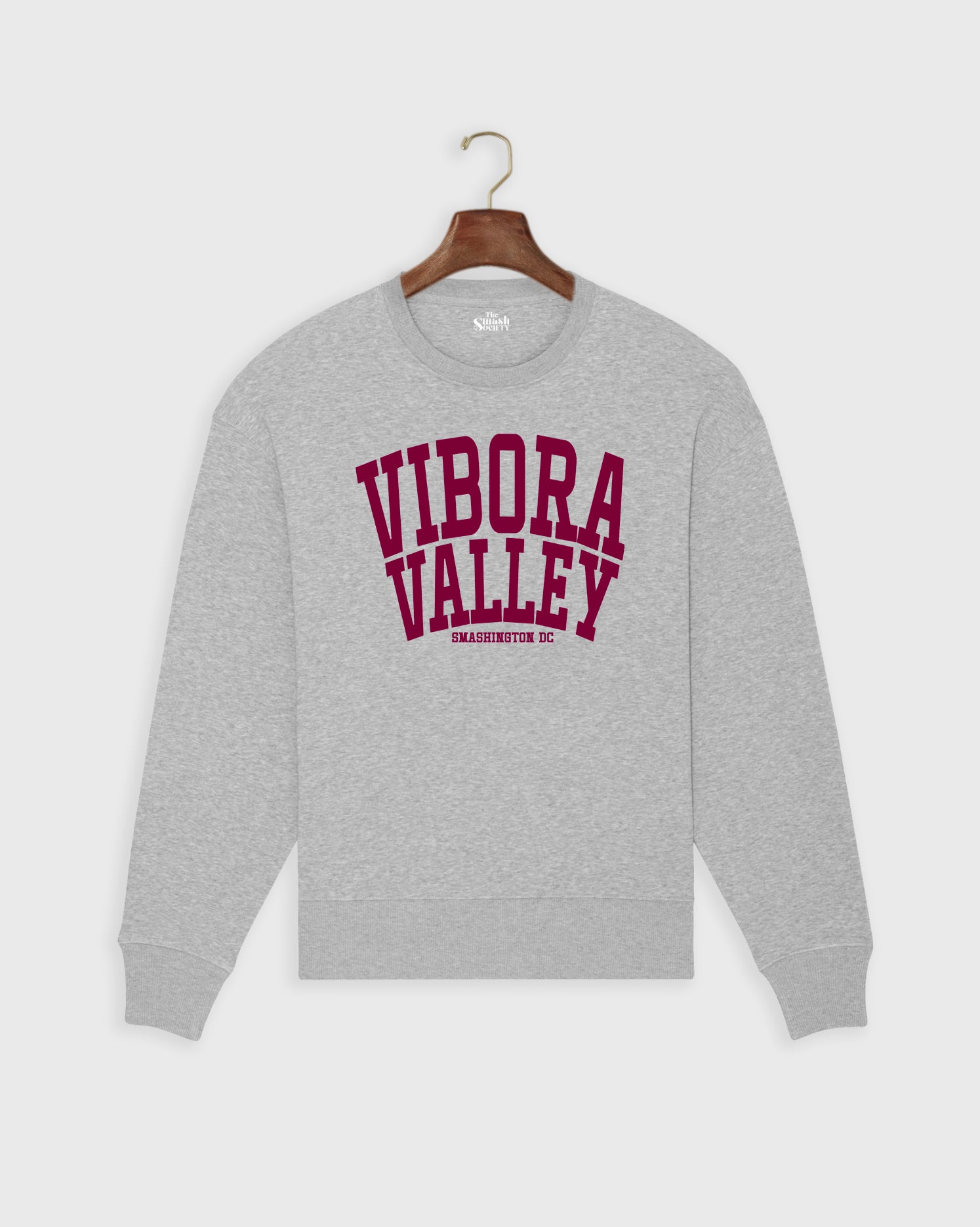 Gray padel sweatshirt with 'Vibora Valley' text on a hanger against a white background